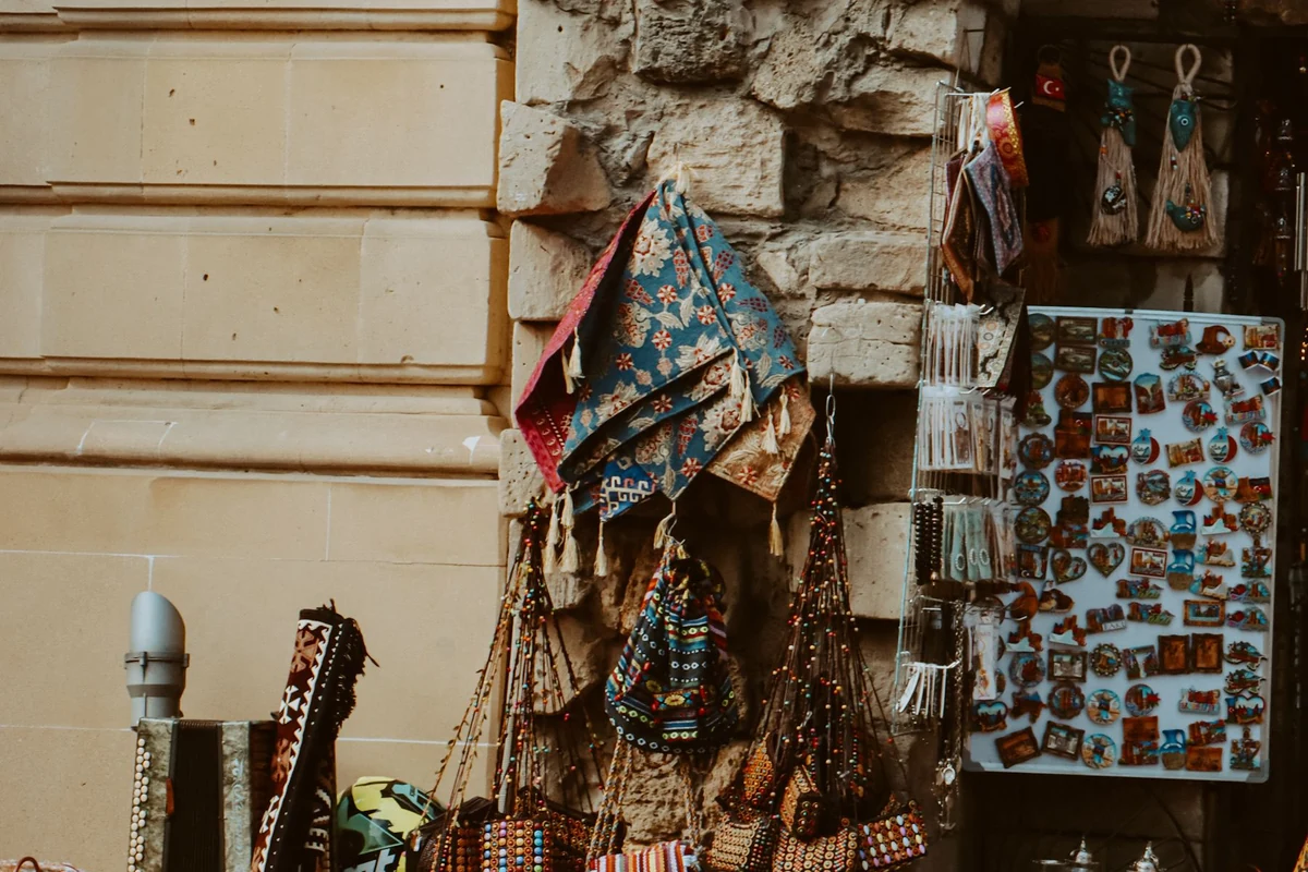 A colourful craft market stall filled with gifts and accessories