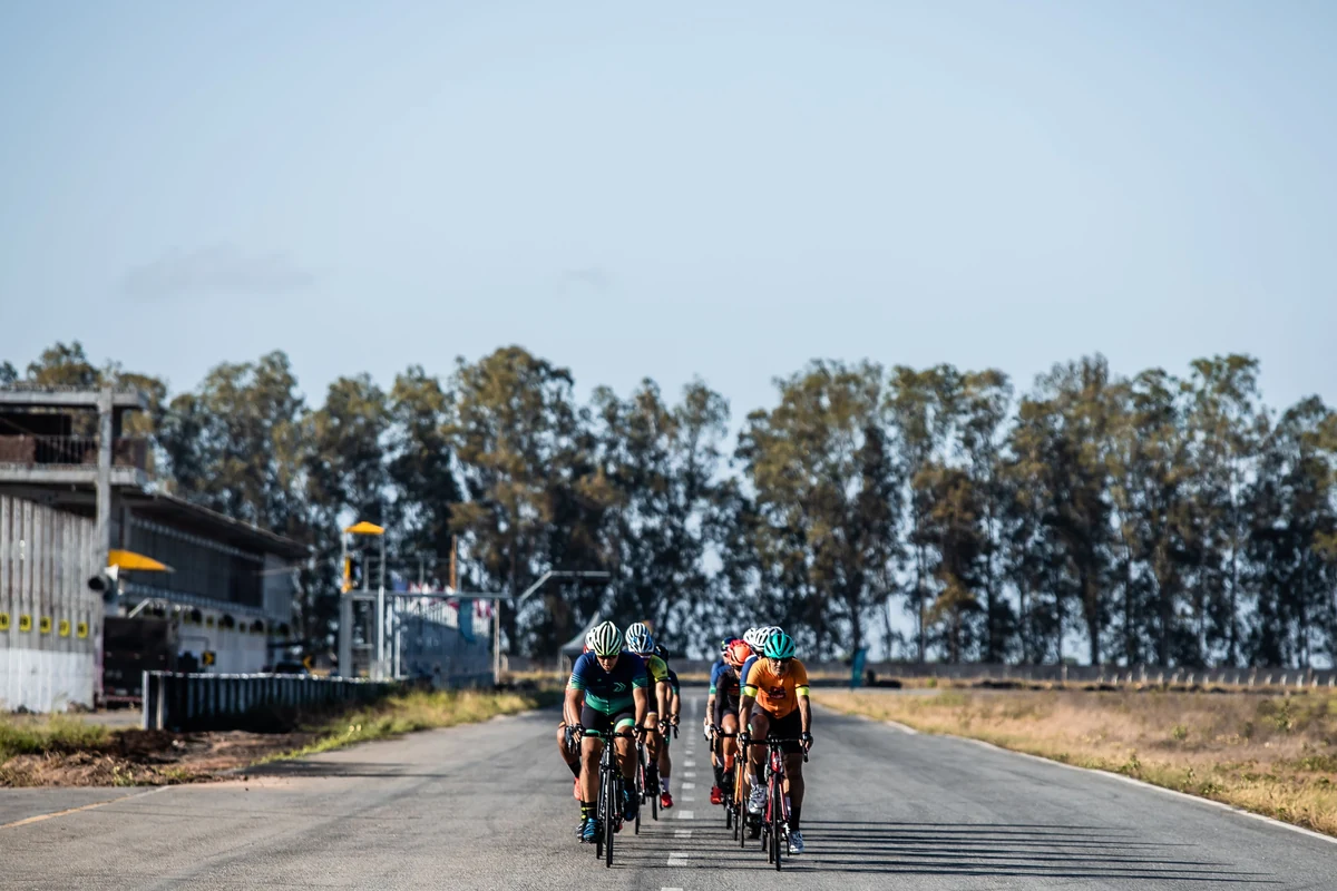 Cyclists riding together on an open road